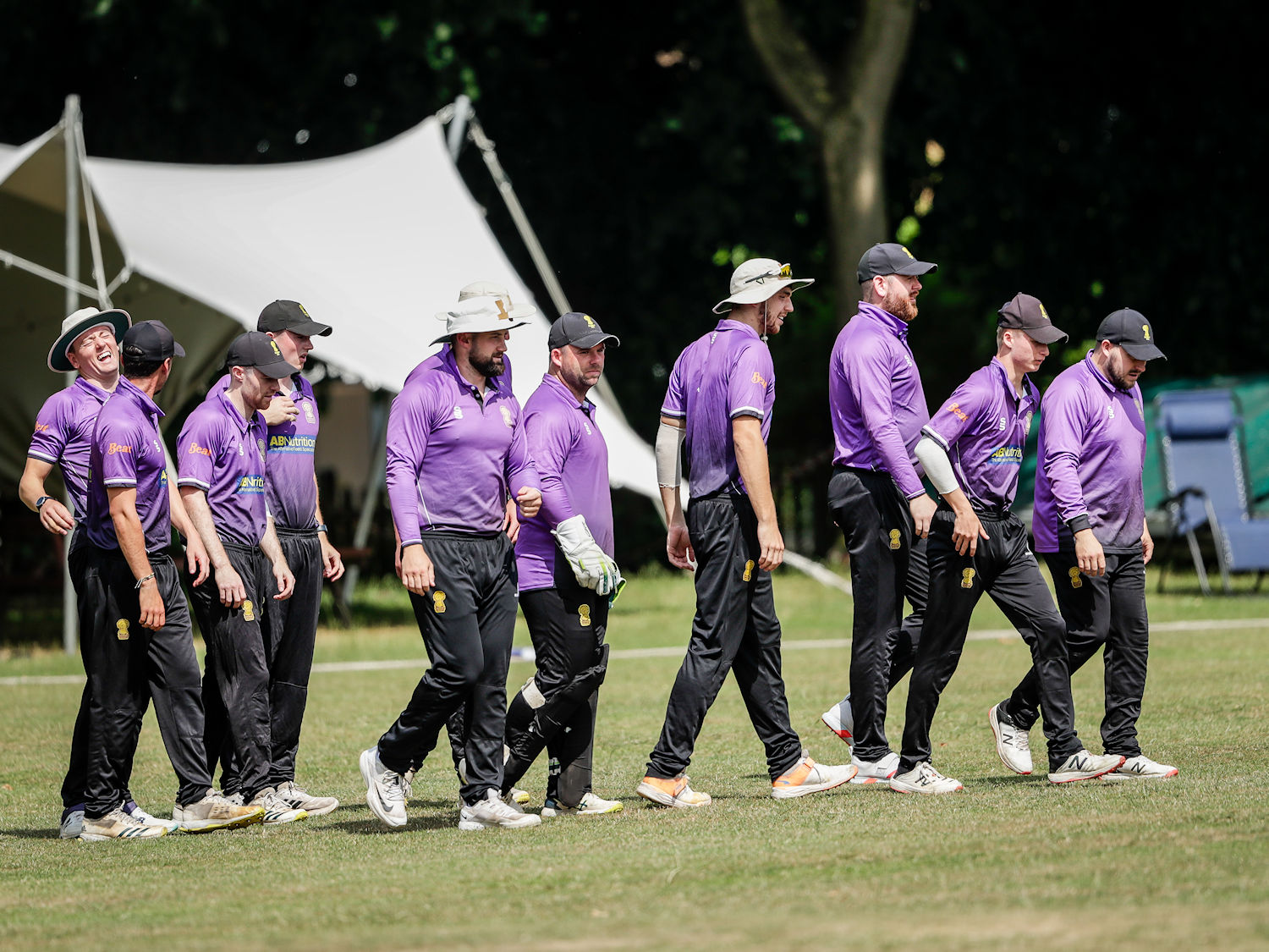 The Cheshire squad walking out for the start of the NCCA Trophy match against Cheshire at Toft Cricket Club on June 25th, 2023.