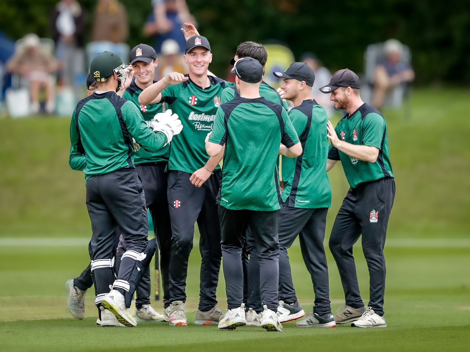 The Cumbria squad celebrate Ben Walkdens run out of Berkshires Archie Carter in the NCCA Trophy final at Wormsley Cricket Ground on August 27th, 2023.
