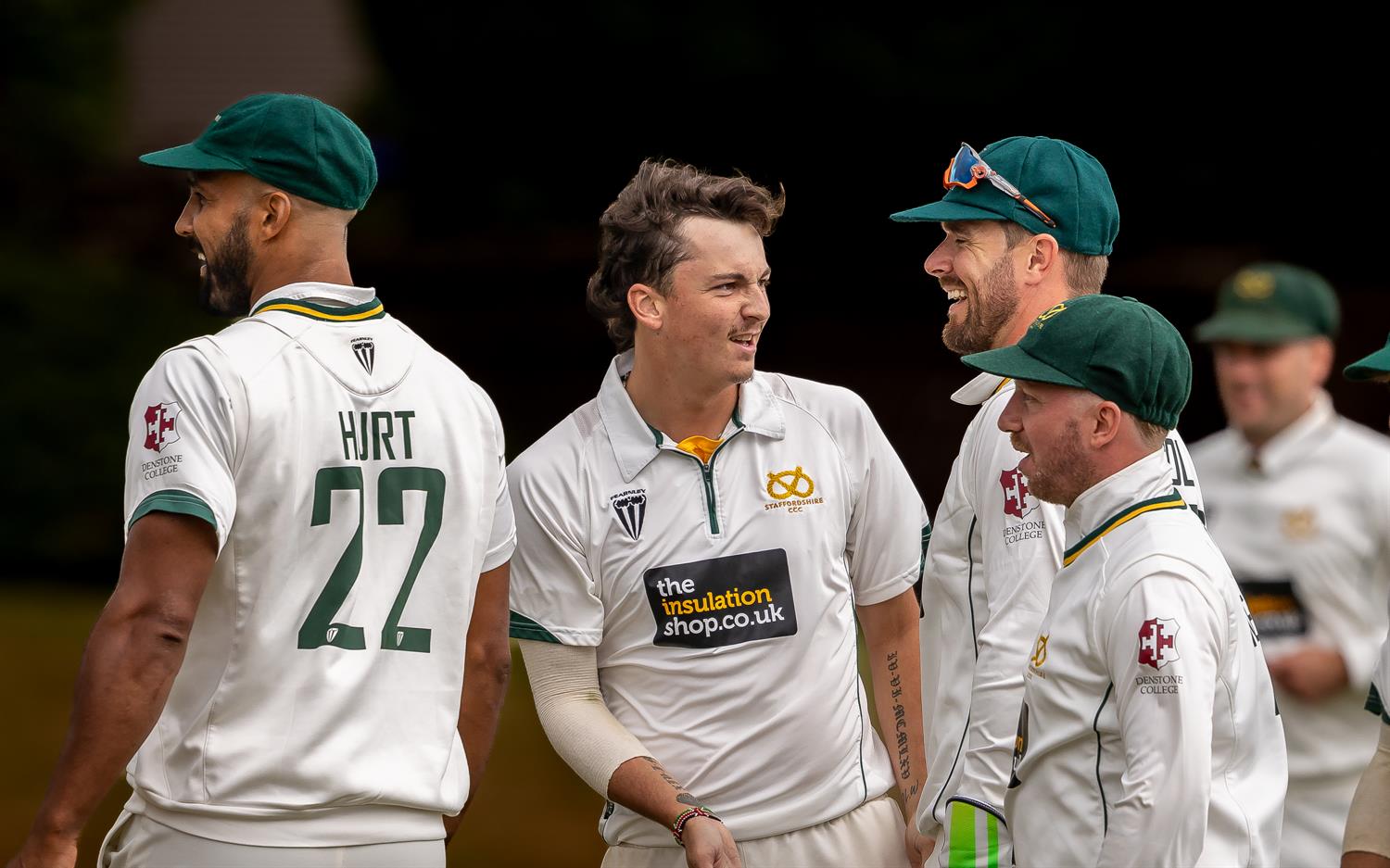 Staffordshire's Sam Keeling-Wright (centre) celebrates with team mates after taking the first of his eight wickets for 60 runs on the first day of the NCCA Cluberly Championship match against Cambridgeshire held at Checkley Cricket Club from July 26th–28th, 2026.