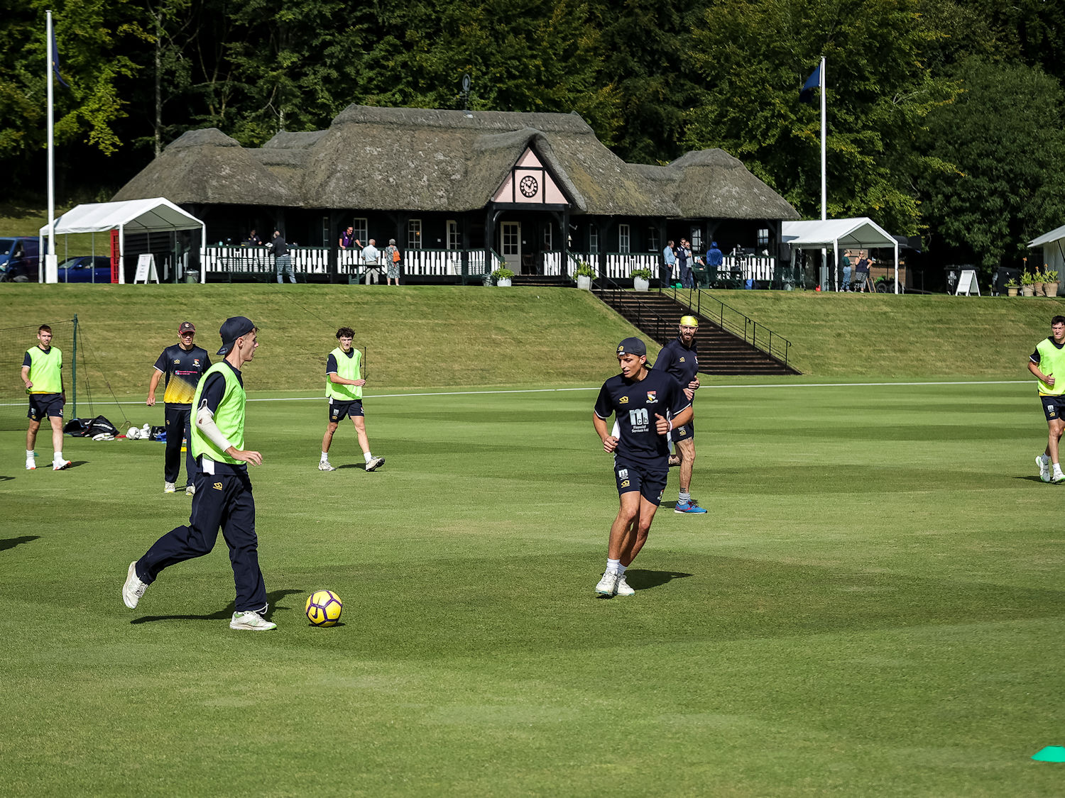The Norfolk squad warming up in front of the pavilion for the NCCA Trophy Final against Cheshire at Wormsley Cricket Ground on August 25th, 2024.