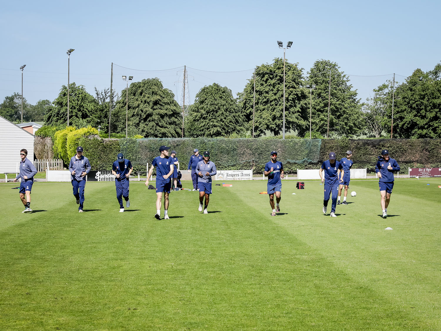 The Suffolk squad warming up for the NCCA Trophy match against Shropshire at Shifnal Cricket Club on June 2nd, 2024.