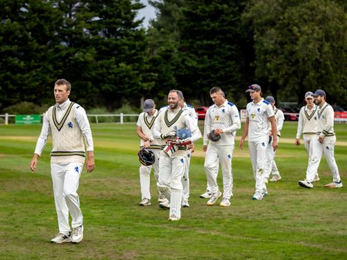 Devon's captain James Horler leads his team from the field after their victory in this year's NCCA Cluberly Championship final.