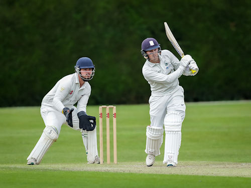 Cornwall's Alex Bone behind the stumps as Berkshire's Rhodri Lewis bats on the first day of the Durant Cricket National Counties Championship match against at Wargrave Cricket Club on July 14th, 2024.